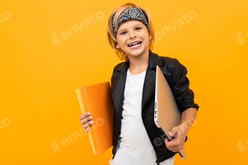 Preview: European Smiling Boy Holds A Folder With Documents And A Laptop On A Yellow Background
