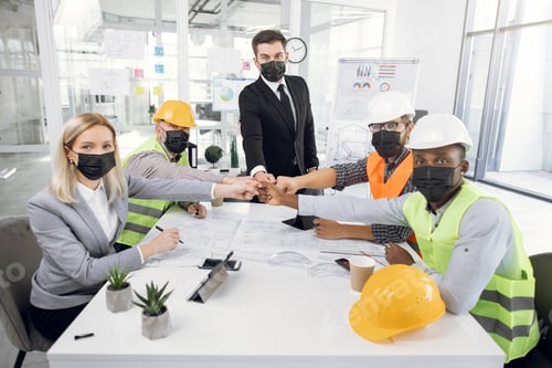 Preview: Group Of Five Multicultural People Wearing Black Medical Mask, Sitting At Office, Bumping With