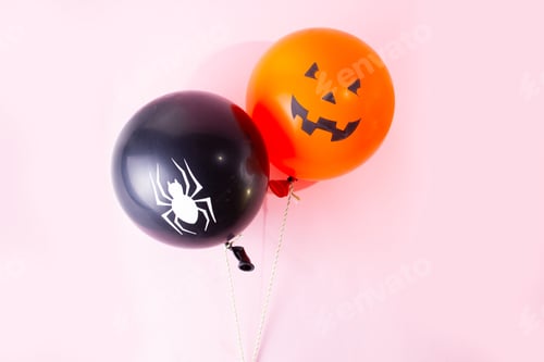 Preview: Halloween Scene With Two Orange And Black Balloons On Pink Background