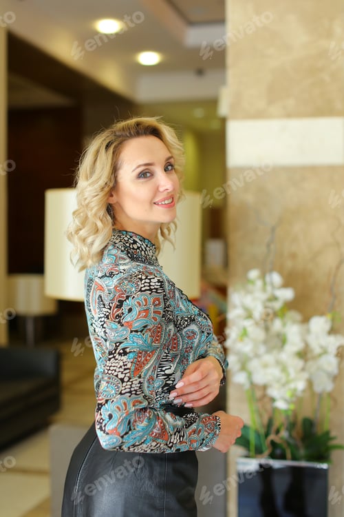 Preview: Nice Woman Standing And Wearing Leather Skirt With Blouse. Concept Of Businesswoman And Interior