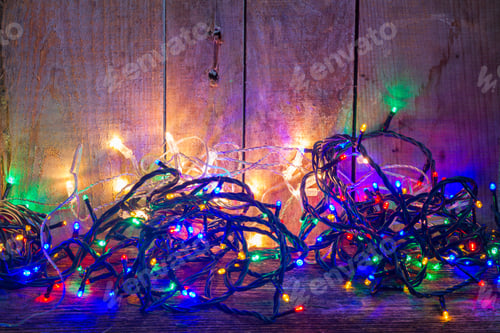 Preview: Christmas Multicolored Lights On Wooden Planked Background