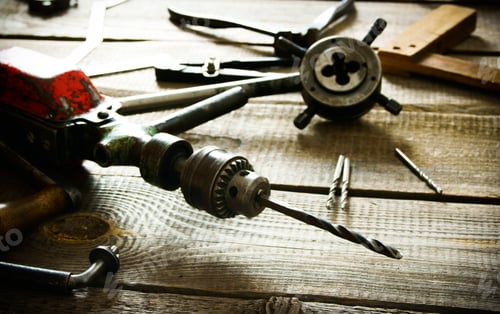 Preview: The Old Working Tool. Old Drill, Compasses, Ruler And Drills On A Wooden Background.