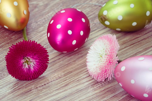 Preview: Easter Eggs With Daisies On Wooden Table