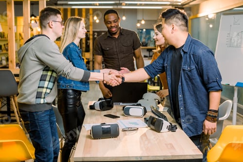 Preview: Team Of Developers Working With Virtual Reality Glasses During A Business Meeting. Young Business