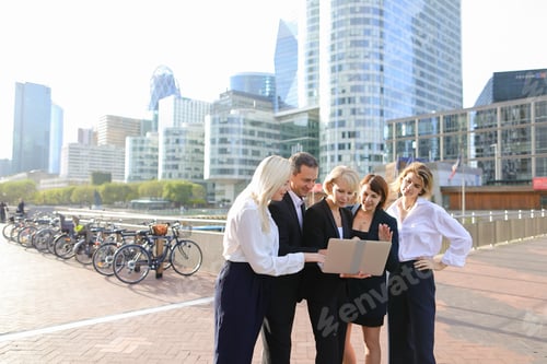 Preview: Business Employees Talking With Boss In La Defense Paris Keeping Laptop And Document Cases. Concept