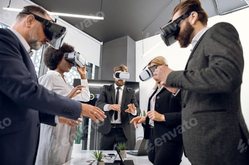 Preview: Group Of Five Multiethnic People Working With Virtual Reality Glasses In Modern Office. New