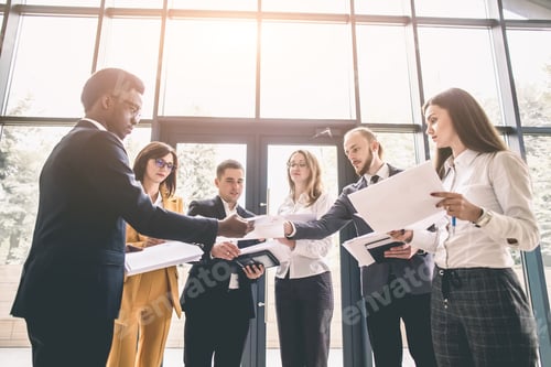 Preview: Team Portrait Of Young And Successful Business People. Group Of Young Businessmen And Businesswomen