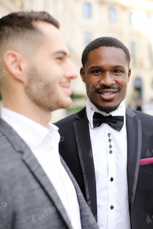 Preview: Focus On Afro American Man Standing Near Caucasian Boy Wearing Suit. Concept Of Businessman And