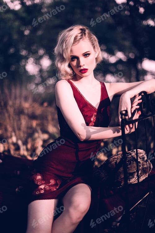 Preview: Beautiful And Elegant Blonde Woman With Red Lips And Hair Waves Wearing Wine Red Nightie Posing On