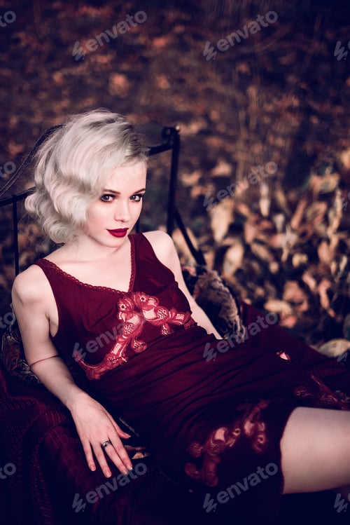 Preview: Beautiful And Elegant Blonde Woman With Red Lips And Hair Waves Wearing Wine Red Nightie Posing On