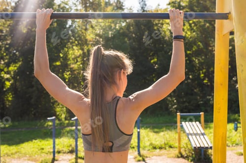 Preview: Fit Woman Doing Pull-Ups