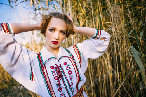 Preview: Young Girl On The Summer Field In National Belarus Clothes, Fashion.Noisy Image. Grain Texture Is