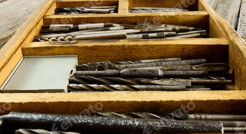 Preview: Old Working Tools. Drills In A Box On A Wooden Background.