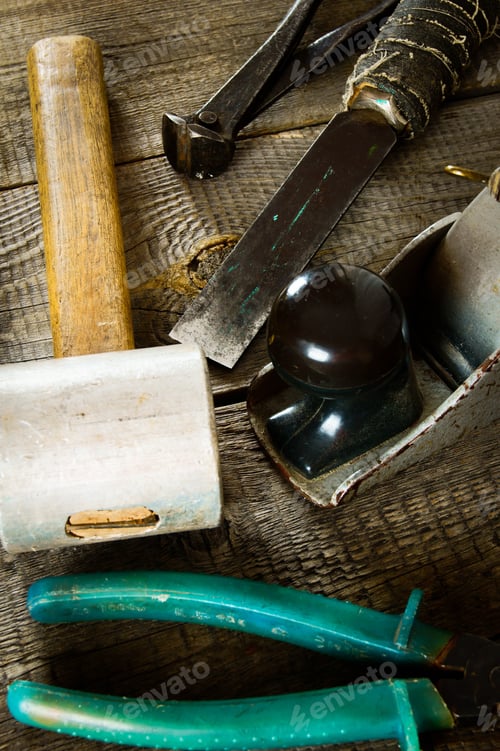 Preview: The Old Working Tool. Many Old Working Tools (Mallet, Plane, Hammer And Others) On A Wooden
