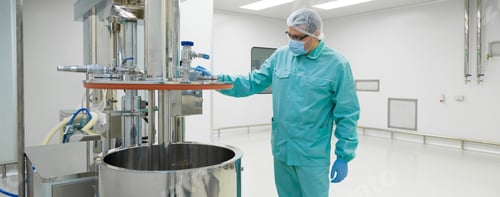 Preview: Pharmaceutical Factory Man Worker In Protective Clothing Working With Control Panel In Sterile