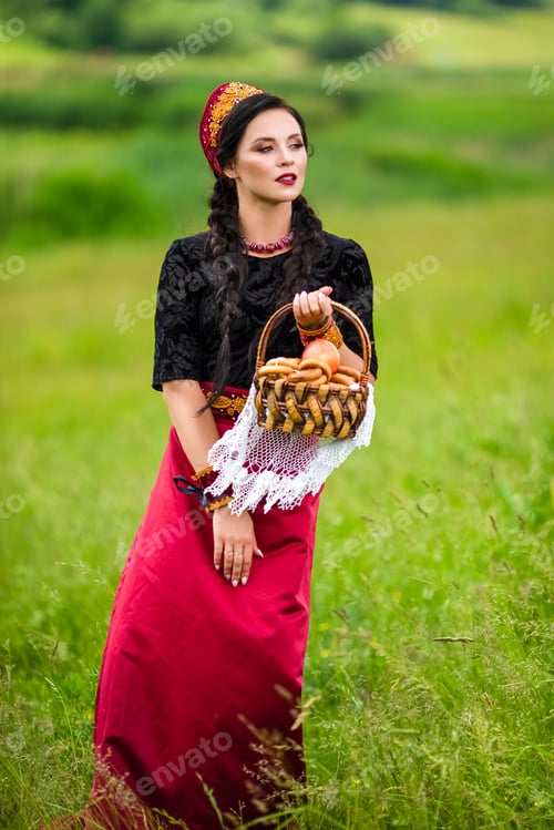 Preview: Fashion Portrait Of Sensual Brunette In Russian Kokoshnik With Basket Of Bread Rings. Posing In
