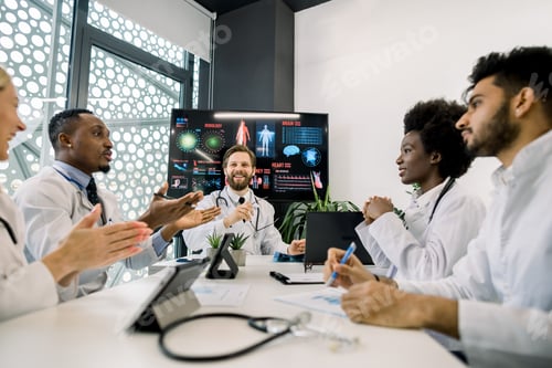 Preview: Multiracial Team Of Doctors Clapping Their Hands, Applauding Each Other And Enjoy Successful