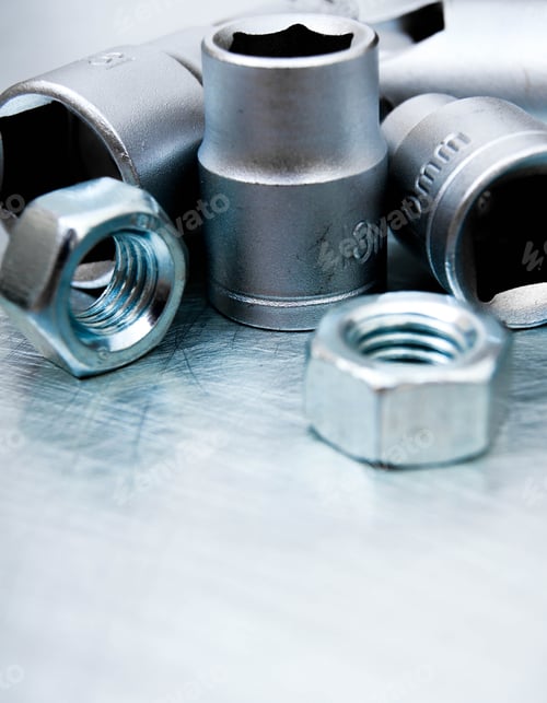 Preview: Wrench Heads And Nuts On The Scratched Metal Background.