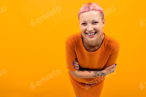 Preview: Extraordinary Beautiful Woman With Short Pink Hair And Big Tattoo On Her Hand Smiles Isolated On