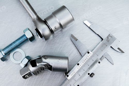 Preview: Metal Style. ?Alliper And Other Metal Tools On The Scratched Metal Background.