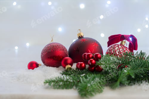 Preview: Christmas Scene With Snow - Red Balls With Evergreen Tree And Lights In Background