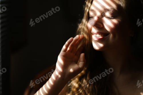 Preview: Close Up Portrait Of Young Smiling Girl With Closed Eyes And Striped Shadows. Concept Of Private