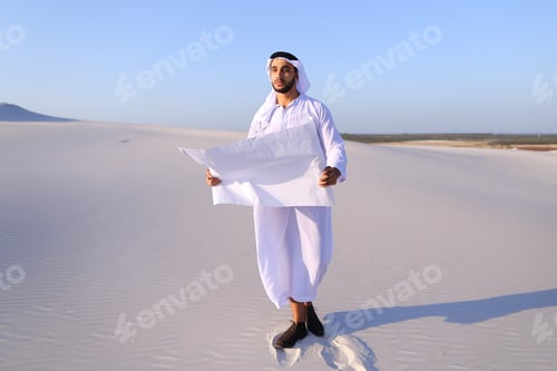Preview: Beautiful Emirate Sheikh Businessman Studying Project Of Future Construction Of Complex, Standing