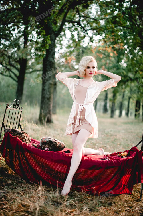 Preview: Beautiful And Elegant Blonde Woman With Red Lips And Hair Waves Wearing Wine Red Nightie Posing On