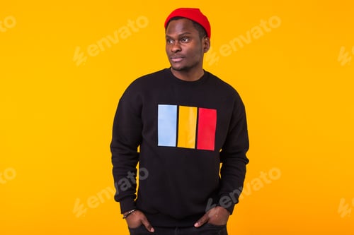 Preview: Street Fashion Concept - Studio Shot Of Young Handsome African Man Wearing Sweatshirt Against