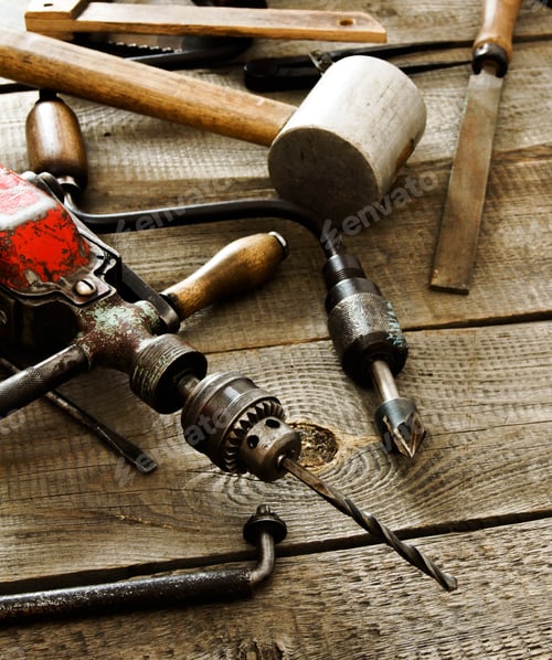 Preview: The Old Working Tool. Many Old Working Tools (Drill, Pliers And Others) On A Wooden Background.