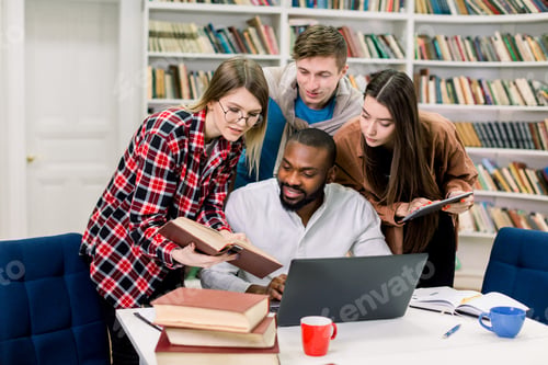 Preview: Group Of Smart Modern Confident Multiethnic Friends, Preparing Together For Exams In The College