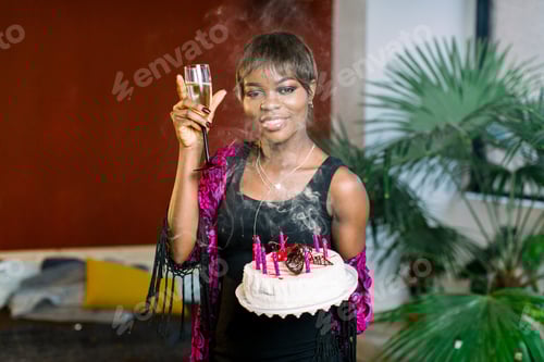 Preview: African American Girl Celebrating Her Birthday And Blowing Candles On Beautiful Birthday Chocolate