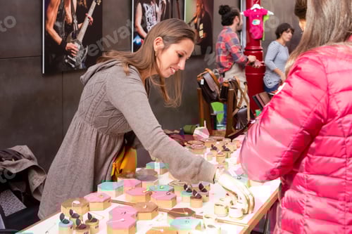 Preview: Porto, Portugal - 27 October, 2018: Young Female Salesperson Offering Jewelry To Customers On Porto
