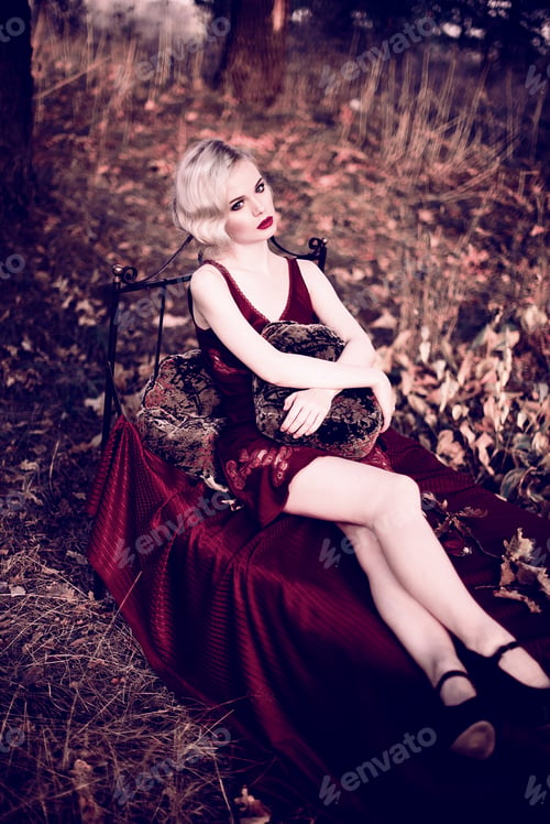 Preview: Beautiful And Elegant Blonde Woman With Red Lips And Hair Waves Wearing Wine Red Nightie Posing On