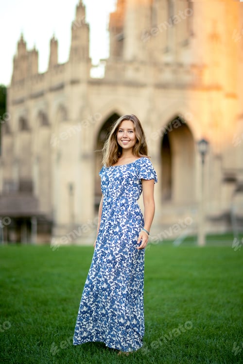 Preview: Full Portrait Of Girl With Dimples, Smile And Looks At The Camera With Long Blonde Hair. Woman Lit