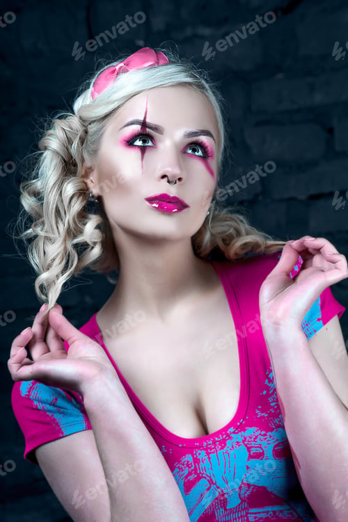 Preview: Beautiful Blonde Girl With Two Pigtails, With Creative Make-Up: Pink Glossy Lips, Wearing Pink