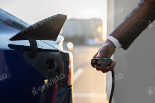 Preview: Close Up Cropped Image Of Unrecognizable Afro American Man In Business Wear, Holding Electricity