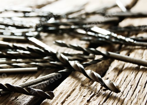 Preview: Working Tools. Drills On A Wooden Background.