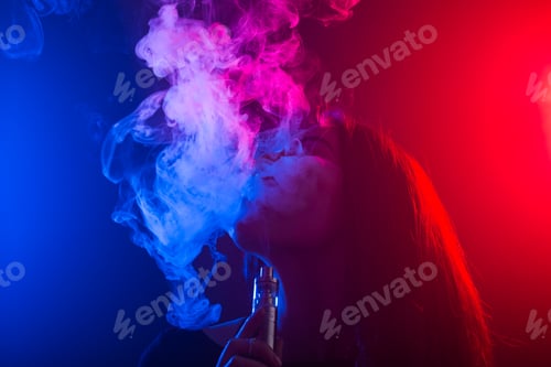 Preview: Portrait Of Girl In Colored Neon Smoke With Vape Or Electronic Cigarette.