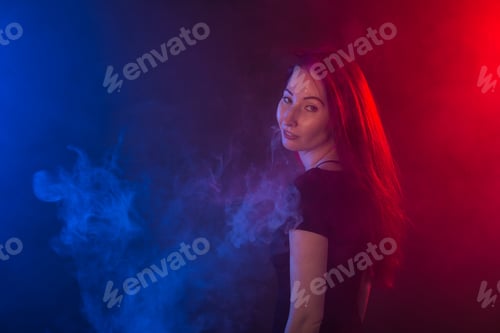Preview: Portrait Of Asian Young Woman In Red And Blue Neon Smoke