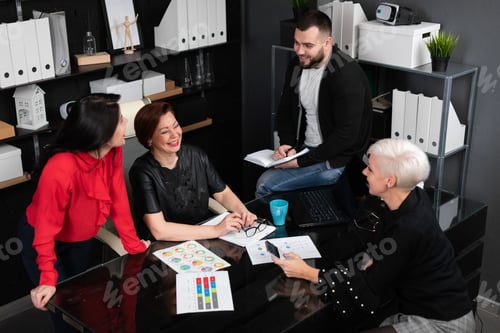 Preview: Smiling Employees Talking In Workplace