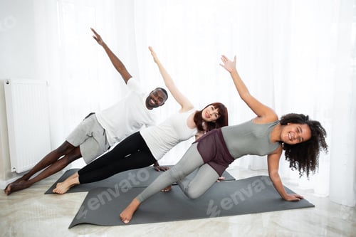 Preview: Happy Sporty Fit Family Doing Gymnastic Exercise In Living Room