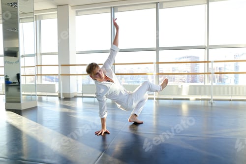 Preview: Male Blonde Dancer Moves With Street Style Elements. Man In White Shirt And Pants Improving Plastic