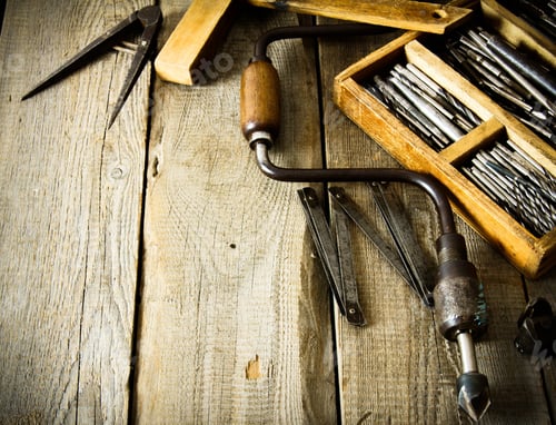 Preview: The Old Working Tool. Old Drill, Compasses, Ruler And Compasses On A Wooden Background.