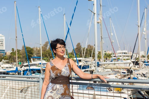 Preview: Leisure Woman On Holiday Near Yacht And Sailboats Marina Resort Town. Luxury Lifestyle.