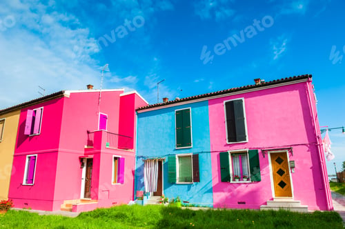 Preview: Pink And Blue Houses Against The Sky. Colorful Architecture On Burano Island, Venice, Italy