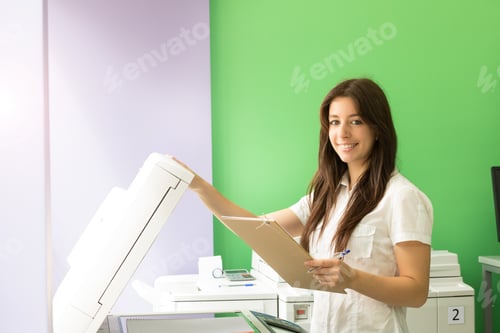 Preview: A Young Student At A Copy Center Taking Some Copies For Her Final Exams