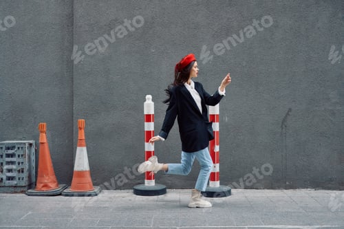 Preview: Fashion woman running down the street in front of the city tourist in stylish clothes with red lips