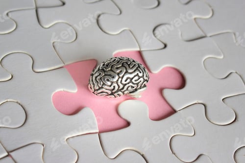 Preview: Alzheimer, amnesia, mental health concept. Brain model and missing puzzle pieces.