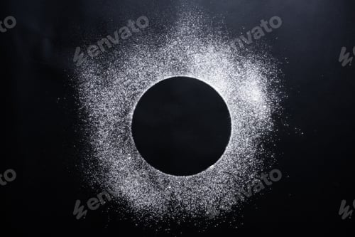 Preview: Abstract background. Sprinkled wheat flour circle, round spot on black.